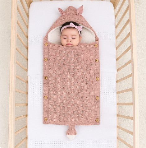 nid-d-ange-bebe-tricote-rose-pour-fille