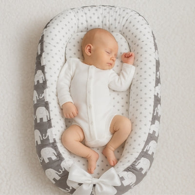nid-bébé-blanc-gris-éléphants
